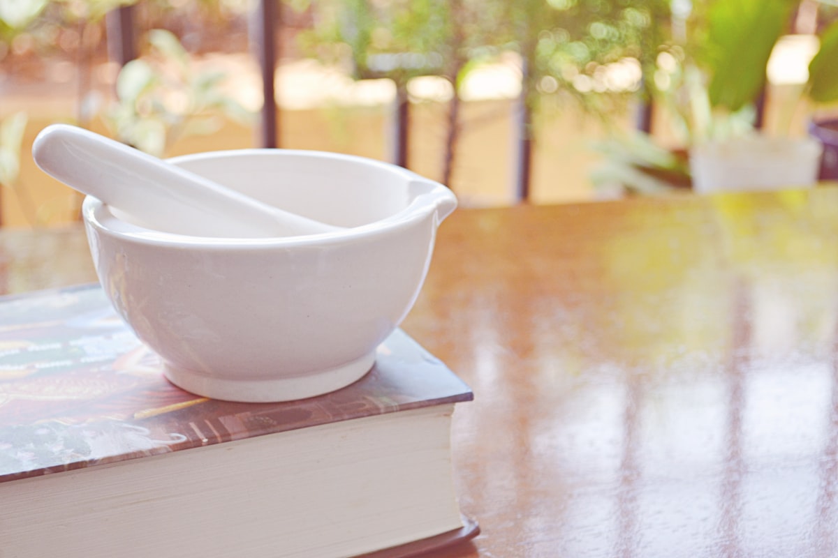 Mediterranean herbs and olive oil representing Southern European wellness traditions